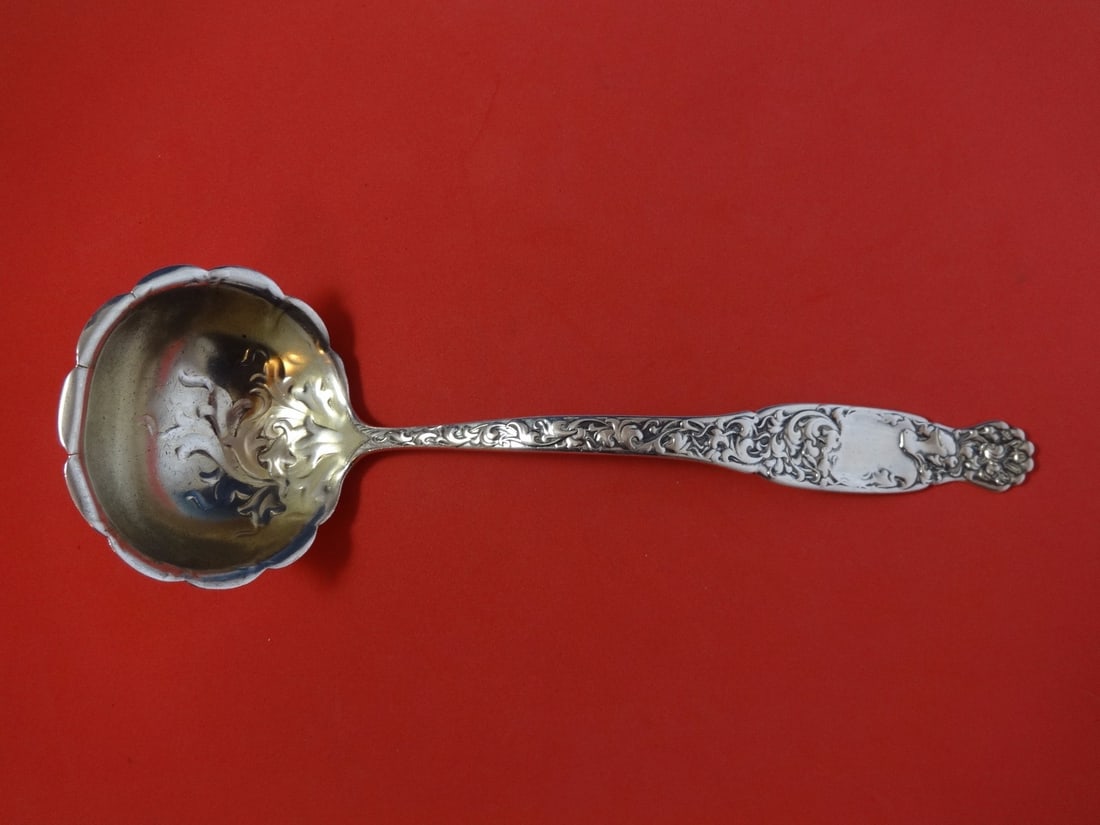 Whiting Heraldic Sterling Silver Gold Washed Soup Ladle 11 1/4": Whiting Heraldic Sterling Silver Gold Washed Soup Ladle 11 1/4" This exquisite soup ladle from the Heraldic pattern by Whiting is crafted from high-quality sterling silver and features a stunning gold