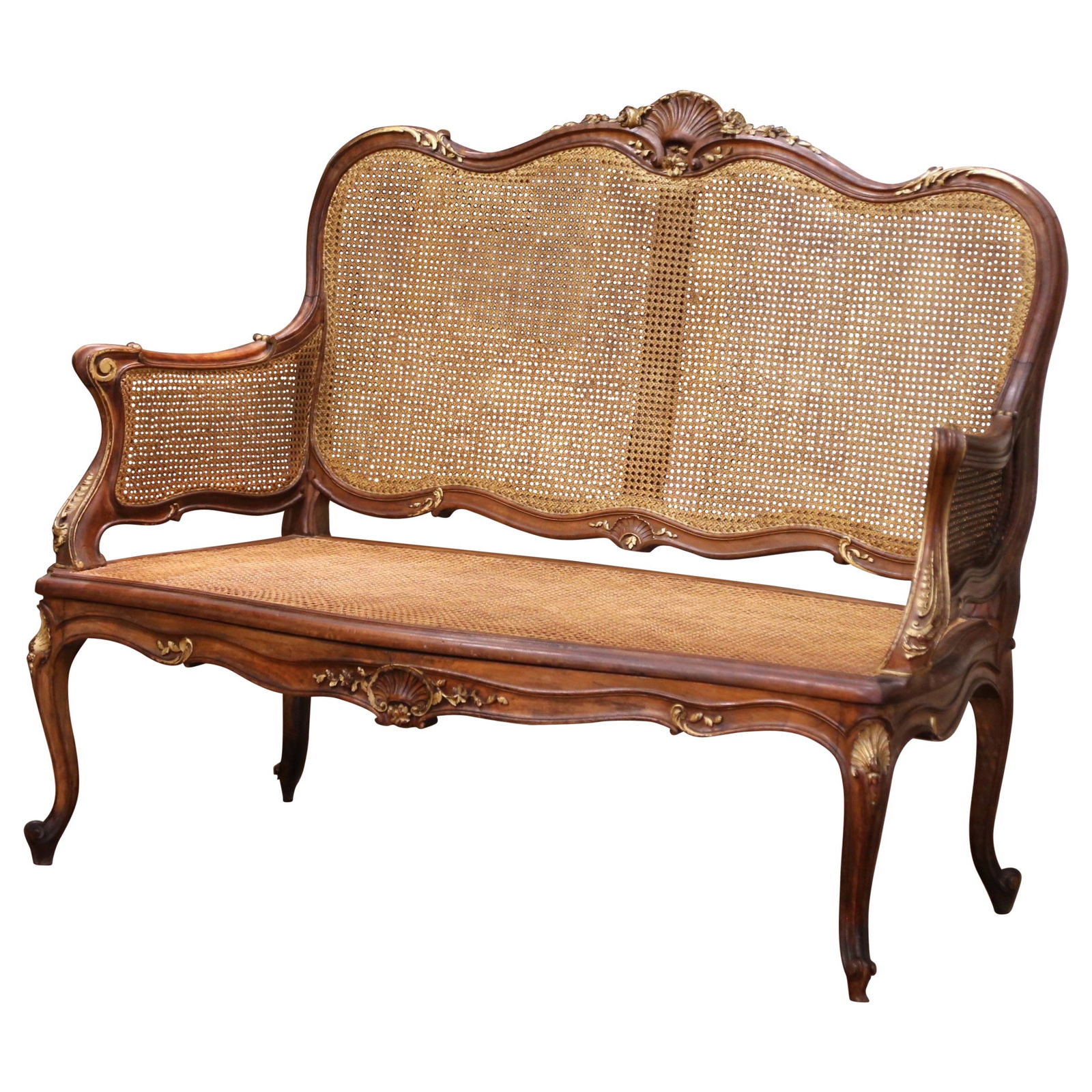 Antique French Louis XV Style Settee Walnut Cane Parcel Gilt 1920: Antique French Louis XV Style Settee Walnut Cane Parcel Gilt 1920 This exquisite early 20th-century French Louis XV style settee, crafted circa 1920, showcases the elegance of traditional design with