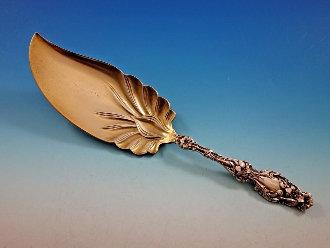 Whiting Lily Sterling Silver Ice Cream Server Gold-Wash 9 7/8": Whiting Lily Sterling Silver Ice Cream Server Gold-Wash 9 7/8" This exquisite ice cream server, crafted in the elegant Lily pattern by Whiting, showcases a beautiful gold-wash finish. Measuring 9 7/8