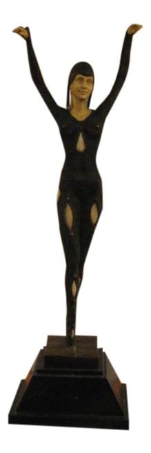 Art Nouveau Bronze Dancer Statue on Black Marble Base: Art Nouveau Bronze Dancer Statue on Black Marble Base This exquisite Art Nouveau style decorative statue features a stunning bronze dancer elegantly poised atop a sleek black marble base. The statue s