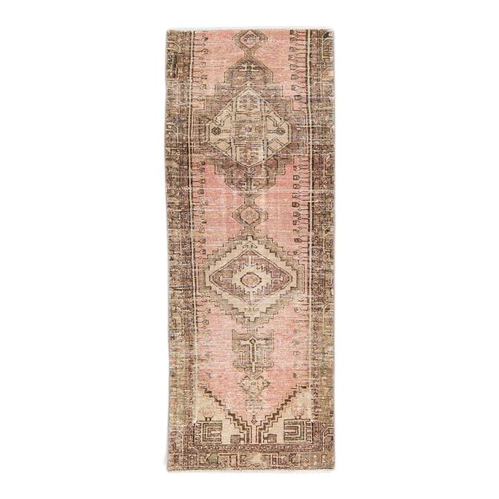 Vintage Tribal Hand-Knotted Pink Wool Rug 2'9 x 7'5: Vintage Tribal Hand-Knotted Pink Wool Rug 2'9 x 7'5 This exquisite vintage tribal rug showcases a stunning hand-knotted design crafted from high-quality wool. Featuring a vibrant pink field adorned wi