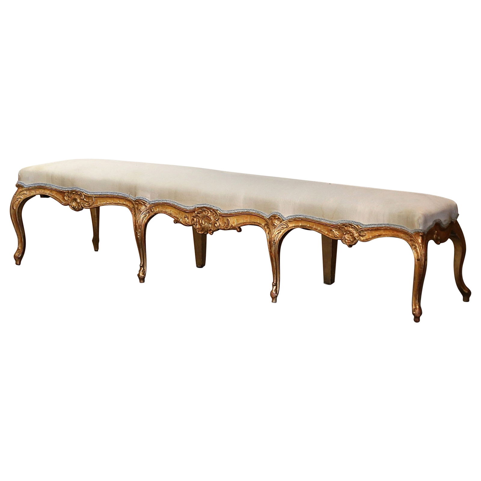 19th Century French Louis XV Hand-Carved Giltwood Upholstered Bench: 19th Century French Louis XV Hand-Carved Giltwood Upholstered Bench Introducing a stunning 19th Century French Louis XV Carved Giltwood Upholstered Eight-Leg Bench, a perfect blend of comfort and eleg