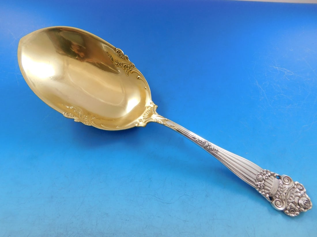 Towle Georgian Sterling Silver Vegetable Serving Spoon Gold Washed 10 1/4": Towle Georgian Sterling Silver Vegetable Serving Spoon Gold Washed 10 1/4" This exquisite Georgian Serving Spoon by Towle is crafted from high-quality sterling silver with a stunning gold wash finish.