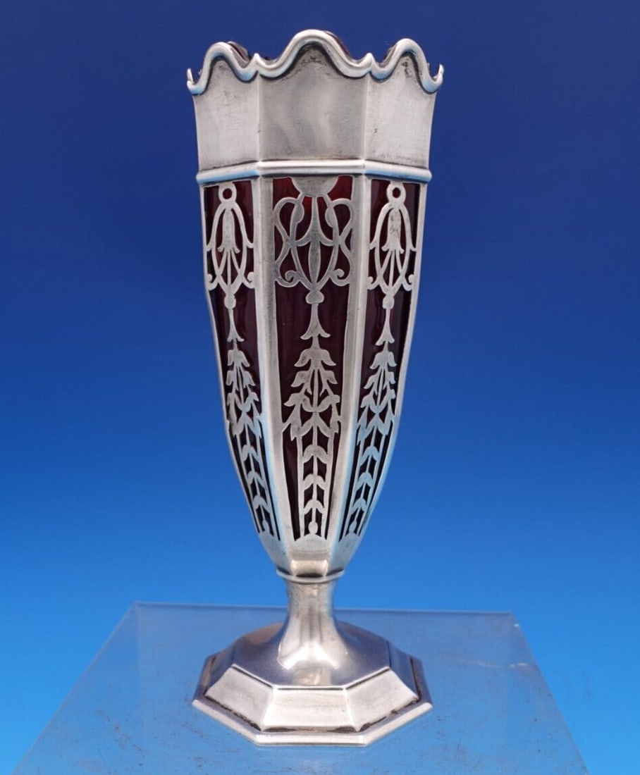 William Lister and Sons Sterling Silver Vase with Ruby Glass Liner: William Lister and Sons Sterling Silver Vase with Ruby Glass Liner This exquisite English estate vase, crafted by William Lister and Sons, showcases a beautiful pierced design with a stunning ruby gla