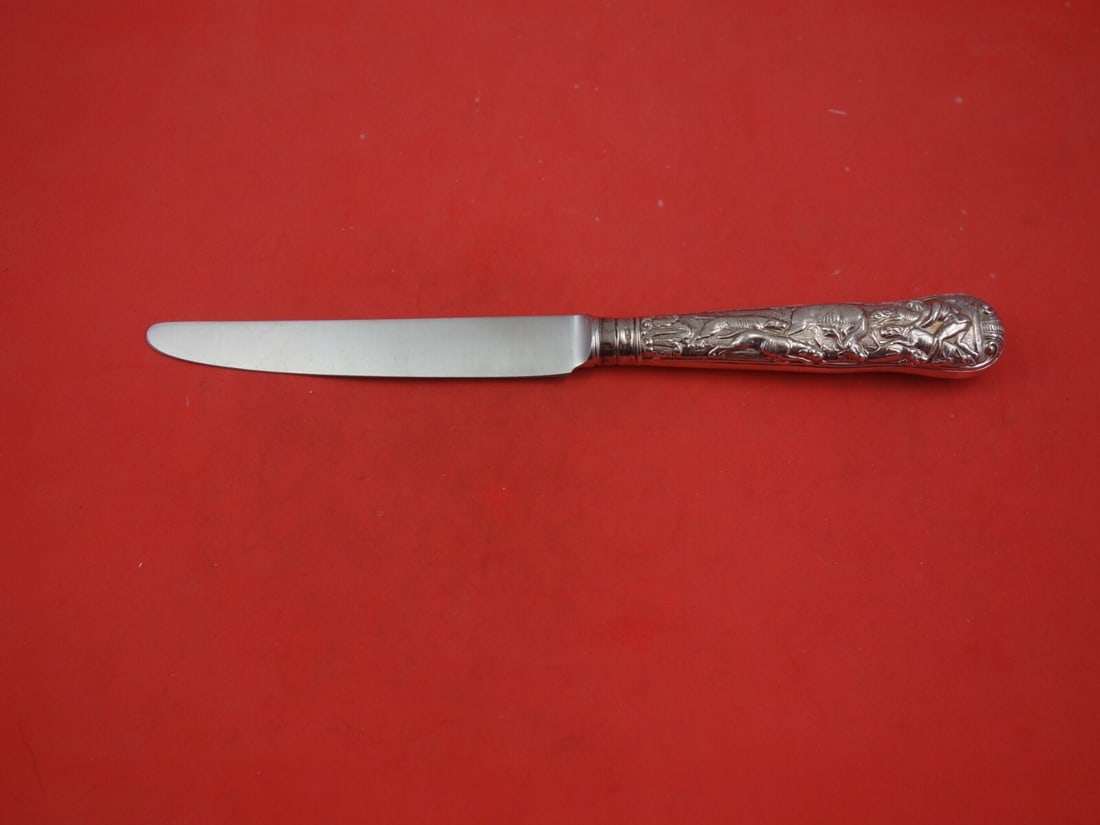 CJ Vander Stag Hunt Sterling Silver Dinner Knife 10 1/4": CJ Vander Stag Hunt Sterling Silver Dinner Knife 10 1/4" This exquisite sterling silver dinner knife by CJ Vander features a French blade design and measures 10 1/4" in length. Adorned with the elegan