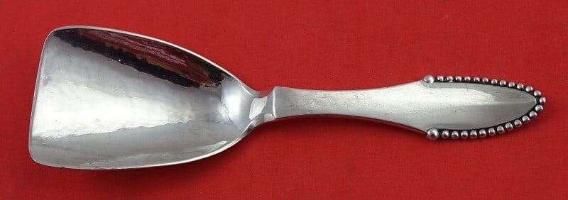Georg Jensen Beaded Sterling Silver Tea Caddy Spoon 4.625": Georg Jensen Beaded Sterling Silver Tea Caddy Spoon 4.625" Discover the elegance of this Georg Jensen Sterling Silver Tea Caddy Spoon, crafted in the iconic Beaded pattern. Measuring 4 5/8 inches, thi