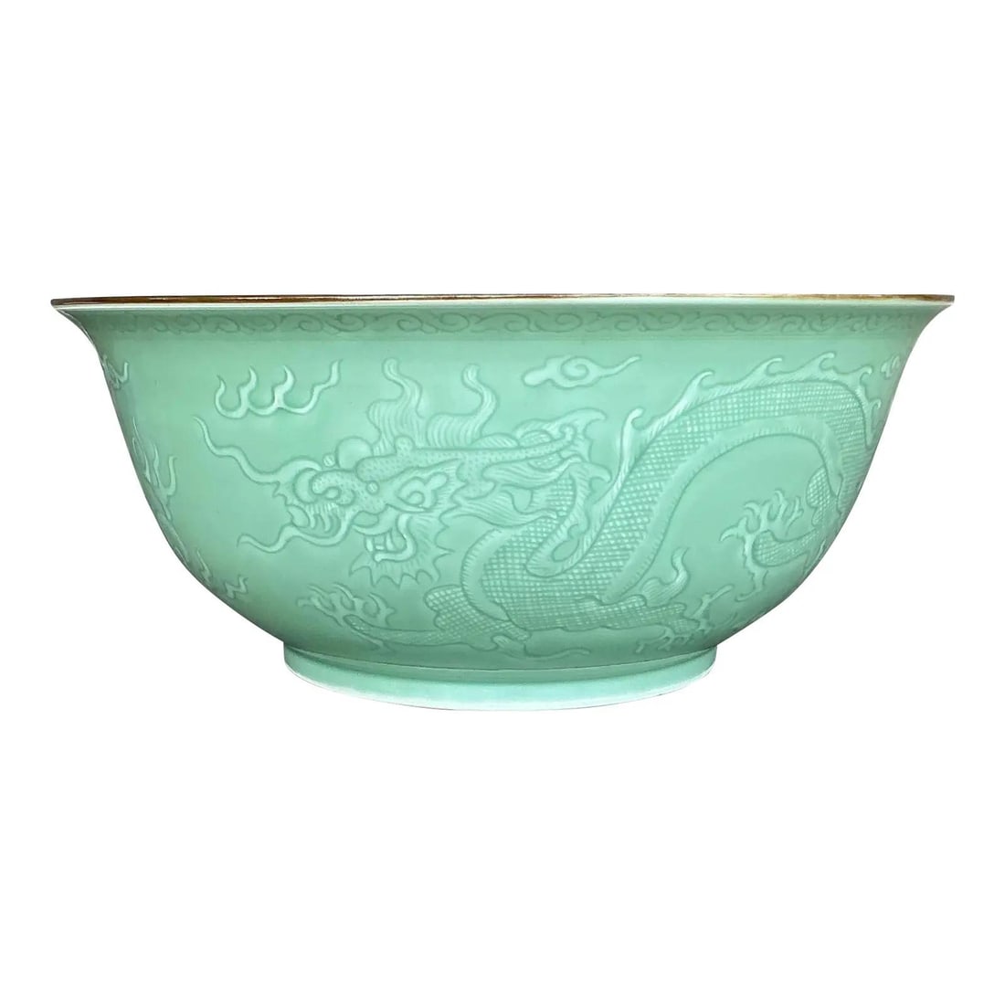 Monumental Celadon Porcelain Bowl with Dragon Relief Design: Monumental Celadon Porcelain Bowl with Dragon Relief Design This exquisite vintage Asian bowl commands attention with its monumental size and masterful craftsmanship. Coated in a serene celadon glaze,