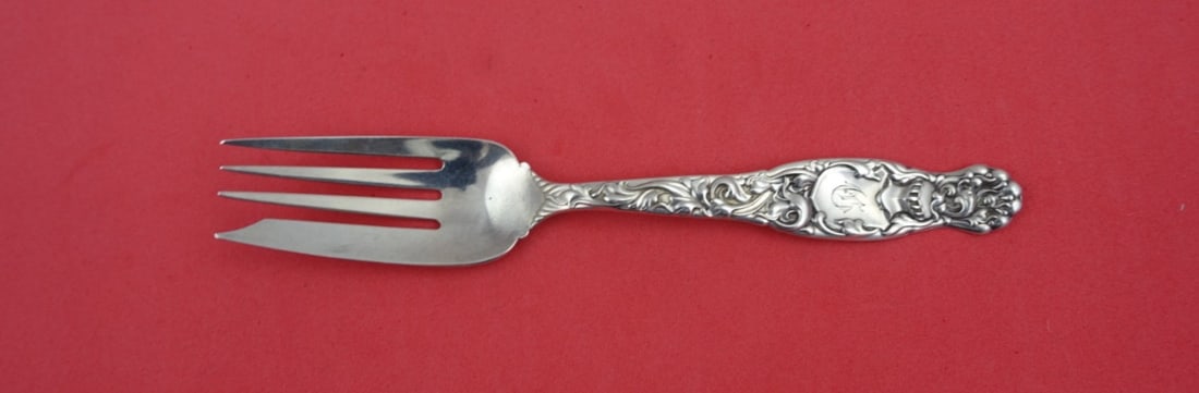 Whiting Heraldic Sterling Silver Beef Fork 6 3/8": Whiting Heraldic Sterling Silver Beef Fork 6 3/8" This exquisite serving fork from the Heraldic pattern by Whiting is crafted from high-quality sterling silver, measuring 6 3/8 inches in length. Made