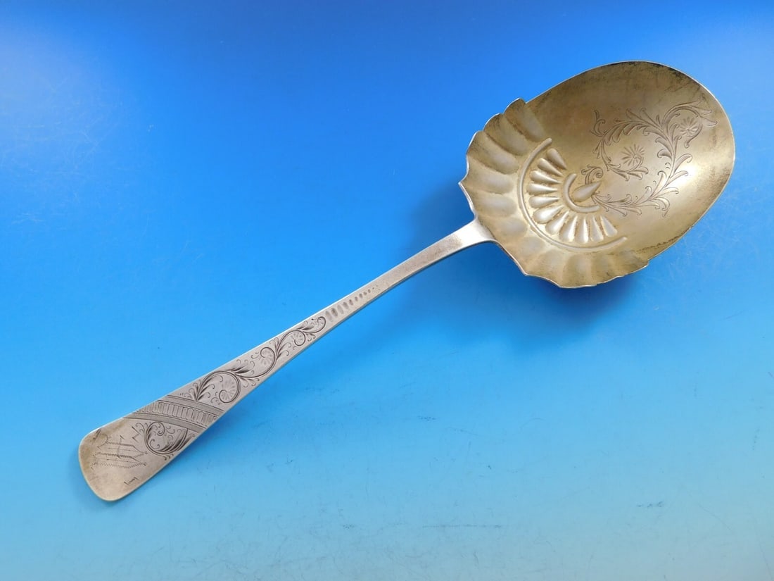 Towle Brite-Cut Sterling Silver Berry Spoon Gold Wash 9": Towle Brite-Cut Sterling Silver Berry Spoon Gold Wash 9" This exquisite Brite-Cut Berry Spoon by Towle showcases a stunning design in the bowl, complemented by a luxurious gold wash. Crafted from high