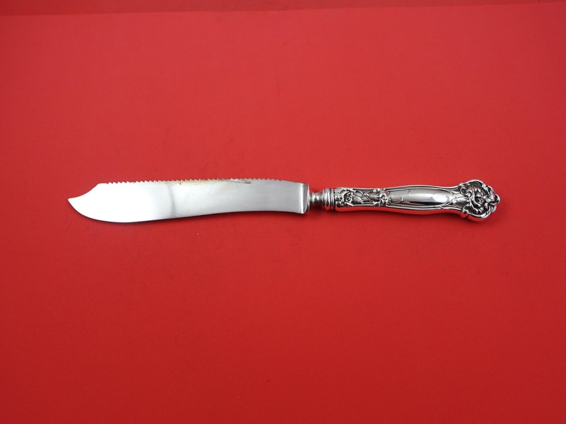 Wallace Carnation Sterling Silver Cake Saw 10 Inch Serrated Blade: Wallace Carnation Sterling Silver Cake Saw 10 Inch Serrated Blade This exquisite cake saw features a sterling silver hollow handle in the elegant 'Carnation' pattern by Wallace. The 10" serrated blade