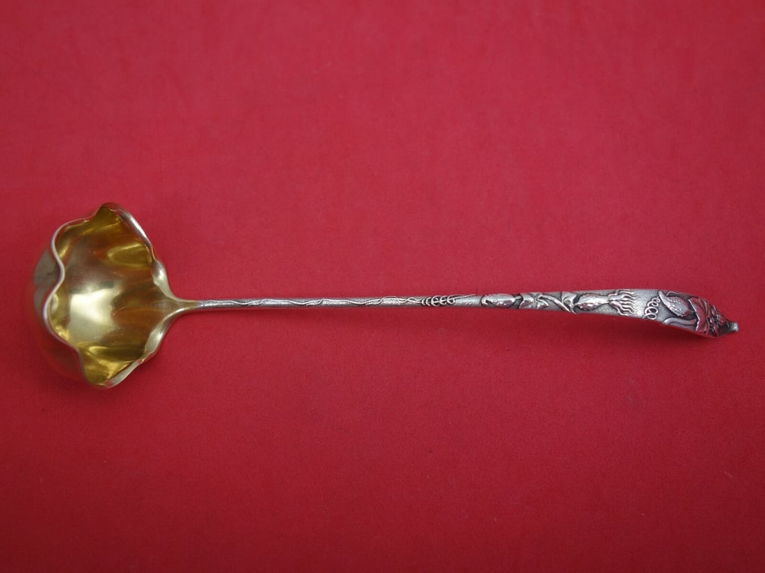 Tiffany & Co. Vine Sterling Silver Sauce Ladle Goldwashed 6 7/8": Tiffany & Co. Vine Sterling Silver Sauce Ladle Goldwashed 6 7/8" This exquisite sauce ladle from Tiffany & Co. features the elegant Vine pattern, crafted in high-quality sterling silver. The ladle is