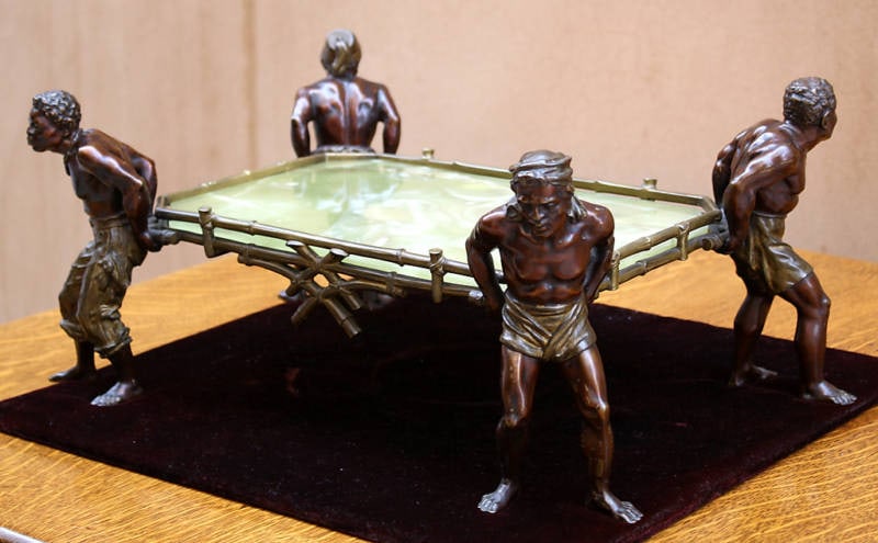 19th Century Austrian Patinated Bronze Center Piece with Onyx: 19th Century Austrian Patinated Bronze Center Piece with Onyx This exquisite 19th century Austrian patinated bronze center piece is a striking example of Orientalism, crafted in the 1890s. The piece s