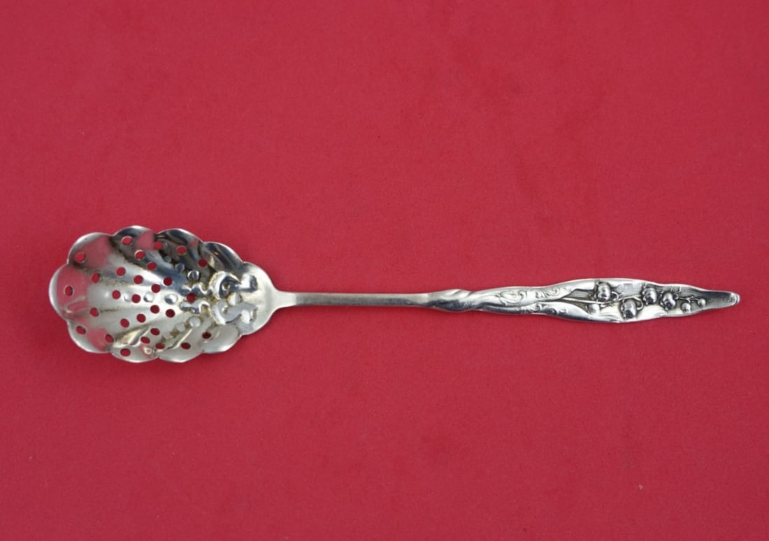 Whiting Sterling Silver 6.5" Lily of the Valley Slotted Olive Spoon: Whiting Sterling Silver 6.5" Lily of the Valley Slotted Olive Spoon This exquisite slotted olive spoon features the elegant "Lily of the Valley" pattern by Whiting, crafted from high-quality sterling