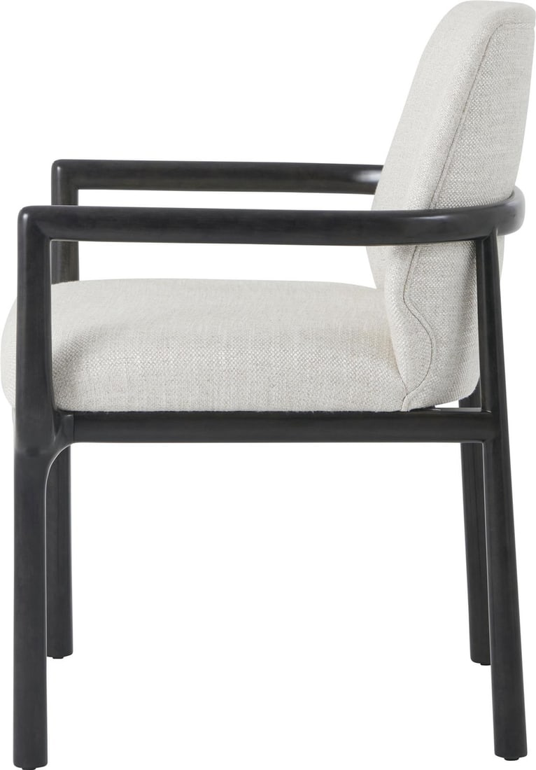 Theodore Alexander Kesden Black Wood Dining Armchair: Theodore Alexander Kesden Black Wood Dining Armchair Elevate your dining experience with the Kesden Black Armchair, a sophisticated addition to any dining space. This dining armchair features a refine