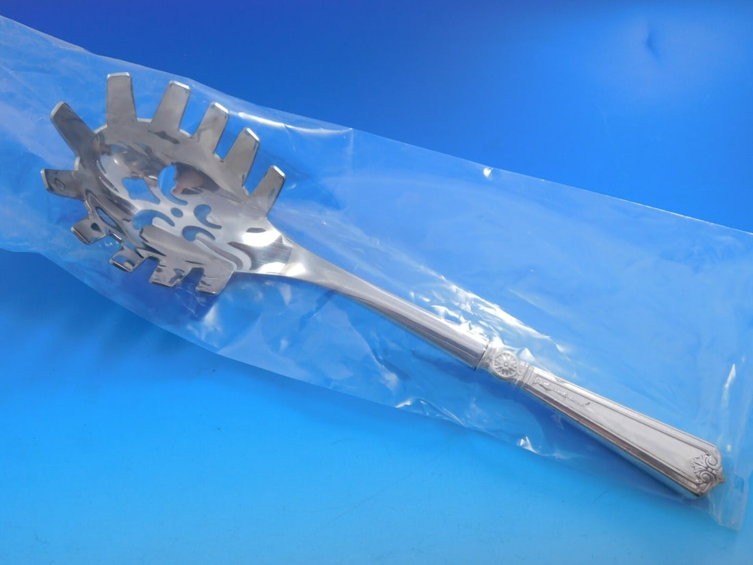 Alvin Bridal Rose Sterling Silver Custom Pasta Server 10 1/8": Alvin Bridal Rose Sterling Silver Custom Pasta Server 10 1/8" This exquisite pasta server is part of the Bridal Rose pattern by Alvin, crafted from high-quality sterling silver. Custom made with a hol