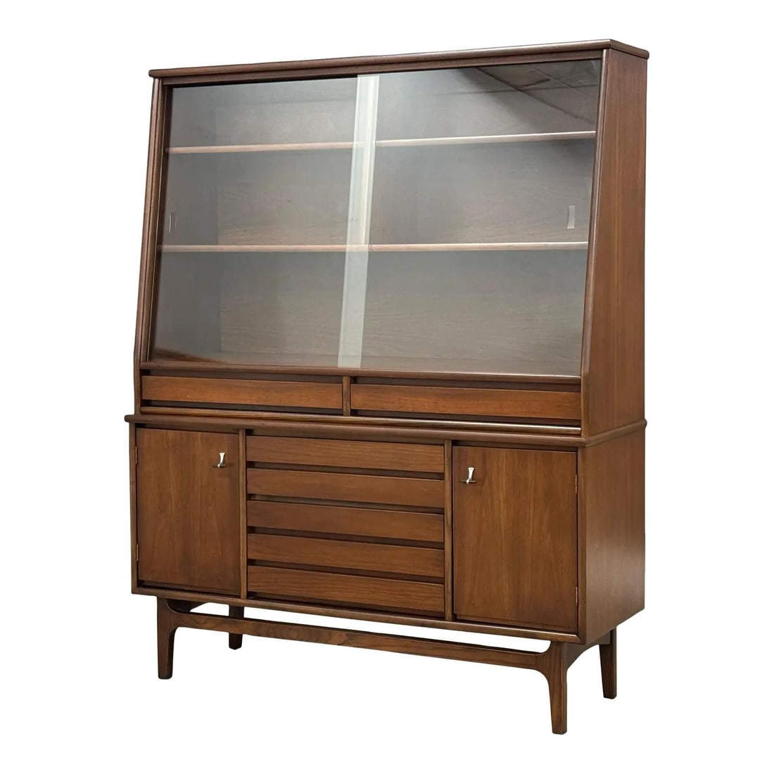 Mid Century Modern Walnut Credenza Hutch by Stanley: Mid Century Modern Walnut Credenza Hutch by Stanley This stunning mid-century modern walnut credenza hutch showcases timeless design and craftsmanship. Featuring a one-piece cabinet structure, it is a