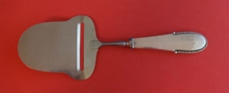 Georg Jensen Beaded Sterling Silver Cheese Plane 8 Inch Serving Tool: Georg Jensen Beaded Sterling Silver Cheese Plane 8 Inch Serving Tool This exquisite cheese plane is crafted by Georg Jensen in the elegant Beaded pattern. Made of high-quality sterling silver, it feat