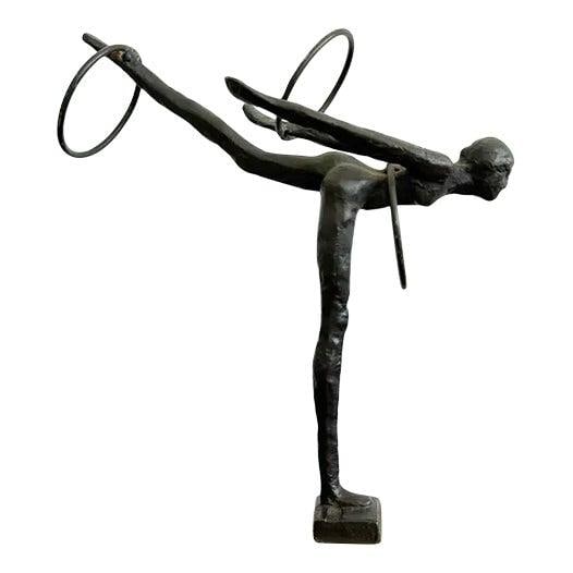 Vintage Bronze Gymnast Sculpture on White Stone Base: Vintage Bronze Gymnast Sculpture on White Stone Base This exquisite vintage bronze sculpture beautifully captures a moment of perfect tension and grace, showcasing the balance between human form and a