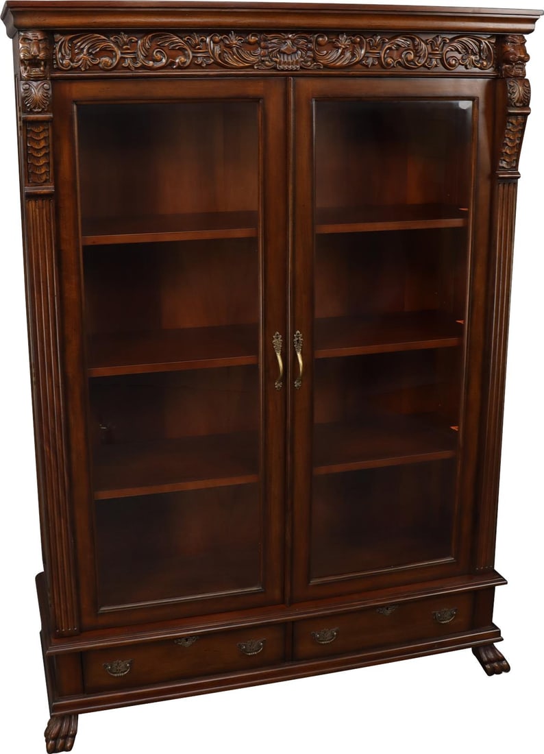 Chippendale Style Mahogany Bookcase with Lion Carvings: Chippendale Style Mahogany Bookcase with Lion Carvings Discover the elegance of this stunning Mahogany Bookcase, showcasing exquisite carved details including lion heads and claw feet. Crafted in the