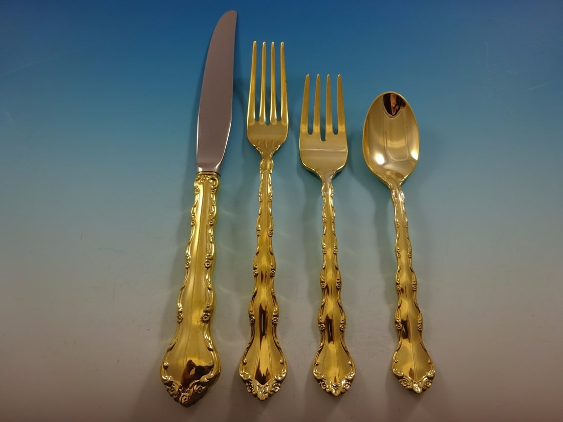 Reed and Barton Tara Gold Vermeil Sterling Silver Flatware Set 48 Pcs: Reed and Barton Tara Gold Vermeil Sterling Silver Flatware Set 48 Pcs Elevate your dining experience with the Tara Gold flatware set by Reed and Barton. This exquisite collection features 48 pieces of