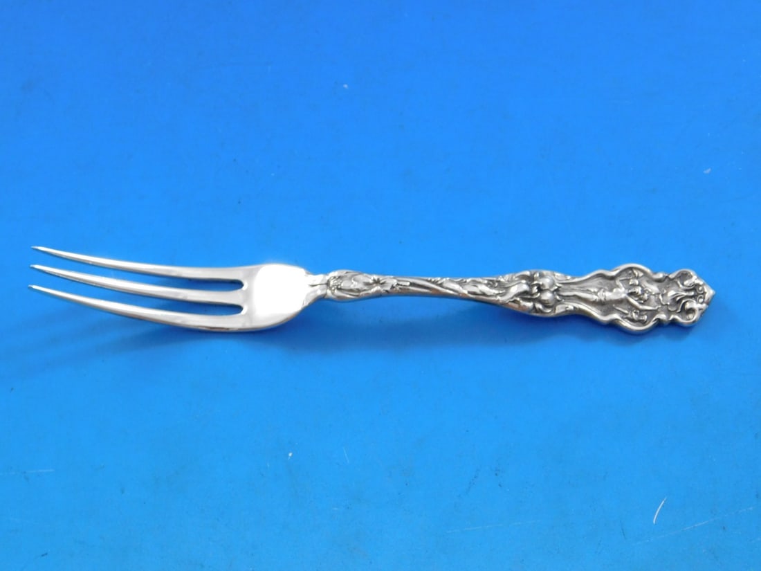 Wallace Irian Sterling Silver Art Nouveau Strawberry Fork 4 3/4": Wallace Irian Sterling Silver Art Nouveau Strawberry Fork 4 3/4" Introduce a touch of elegance to your table setting with this exquisite Irian strawberry fork by Wallace. Crafted from sterling silver,