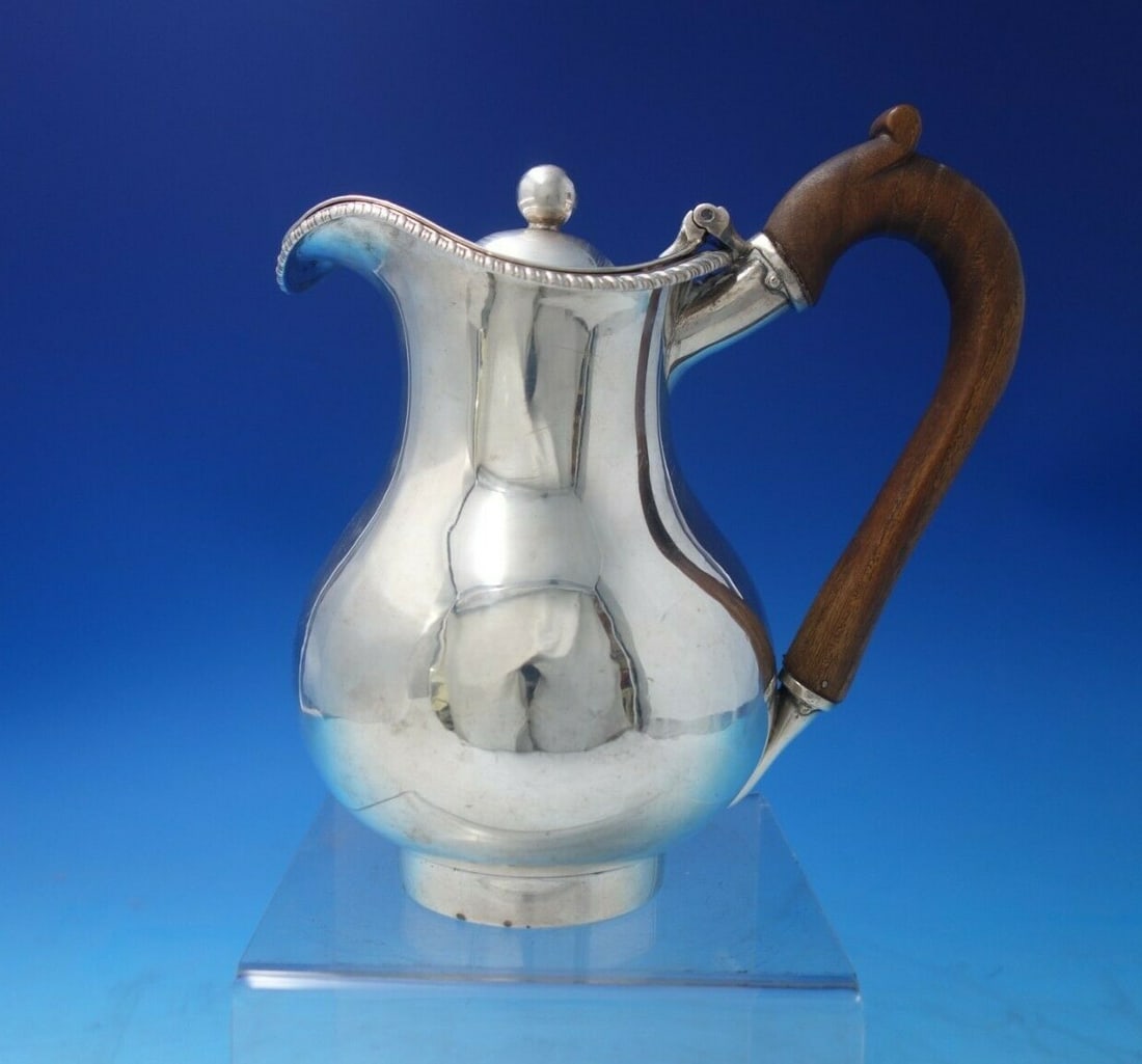 Georgian John Cramer Sterling Silver Syrup Pitcher with Wood Handle: Georgian John Cramer Sterling Silver Syrup Pitcher with Wood Handle This exquisite syrup or milk pitcher, crafted by John Cramer, showcases the elegance of English Georgian design, dating back to circ