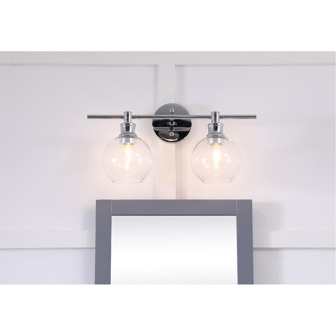 Collier Modern 2 Light Chrome Wall Sconce with Clear Glass Shades: Collier Modern 2 Light Chrome Wall Sconce with Clear Glass Shades Illuminate your space with this modern 2-light wall sconce, featuring a sleek chrome finish and clear glass shades. Designed for versa