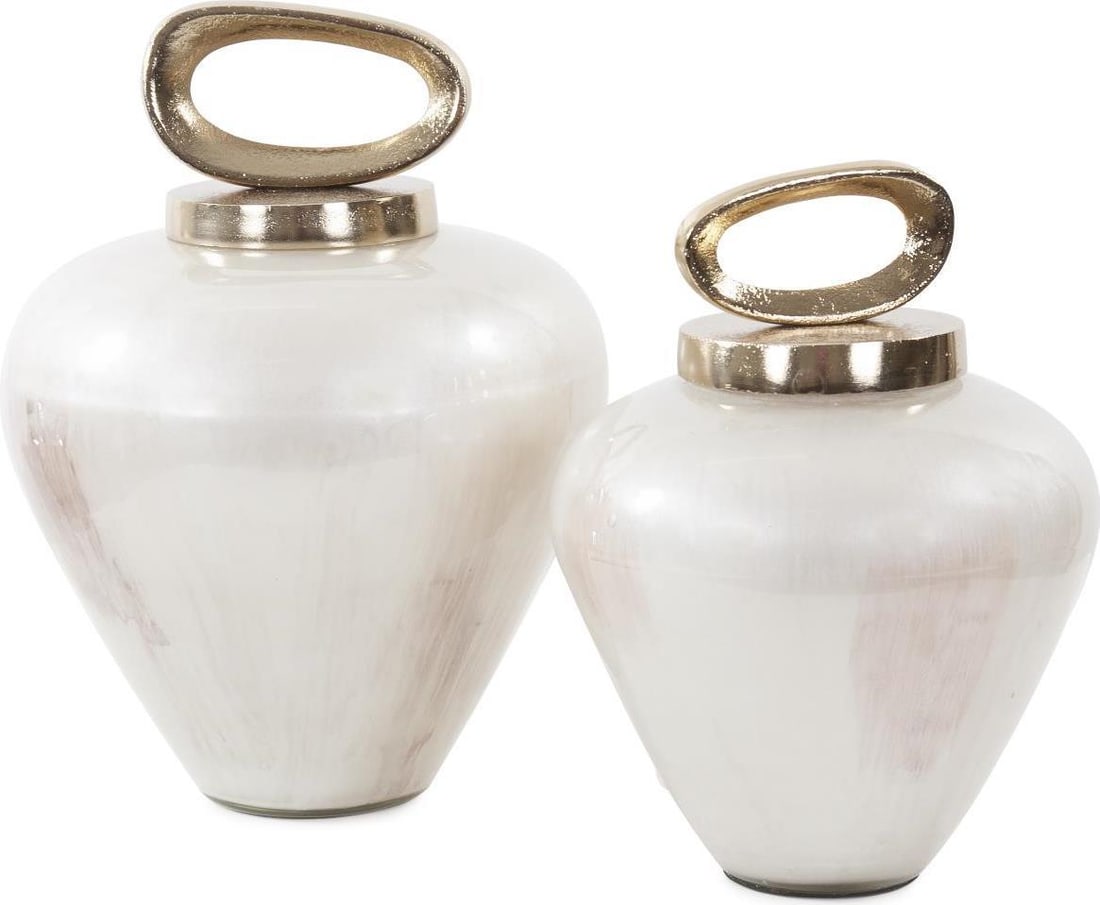 Howard Elliott Luxe Reza Urn Pearl Polished Glass Metal 12H: Howard Elliott Luxe Reza Urn Pearl Polished Glass Metal 12H Introducing the Luxe Reza Urn, a stunning combination of glass and metal that adds an elegant touch to any decor. This exquisite urn feature
