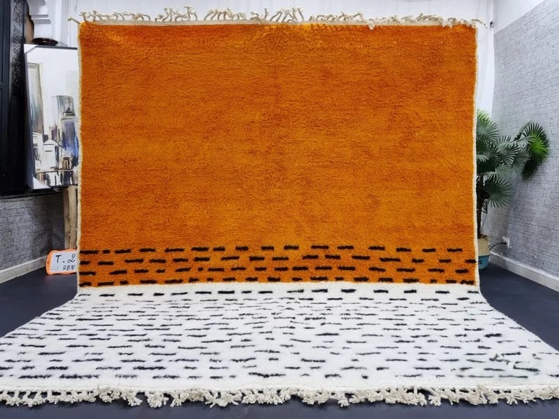 Authentic Handmade Wool Rug from Morocco 9.84 x 6.56 Feet: Authentic Handmade Wool Rug from Morocco 9.84 x 6.56 Feet Experience the charm of the Atlas Mountains with this stunning authentic handmade wool rug. Crafted by skilled local Berber women weavers, thi