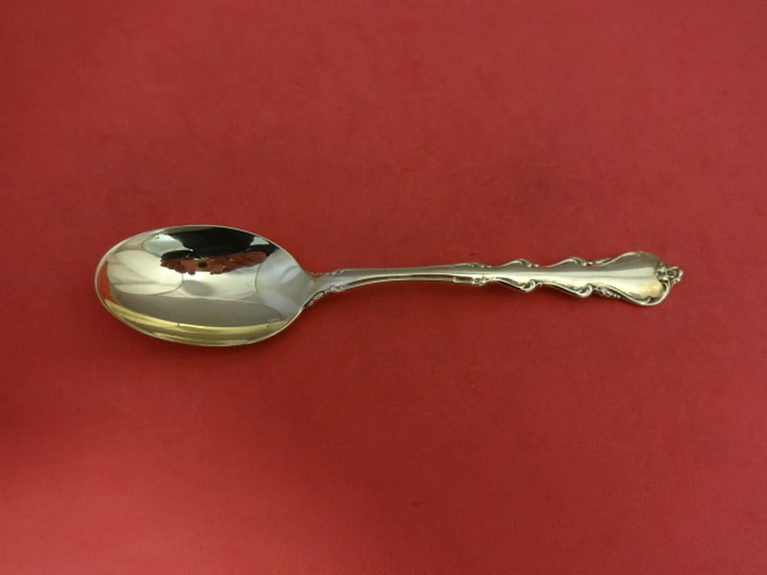 International Sterling Silver Angelique Gold Place Soup Spoon 6 5/8": International Sterling Silver Angelique Gold Place Soup Spoon 6 5/8" This pre-owned Angelique Gold place soup spoon from International Sterling is a stunning addition to your tableware. Crafted from h