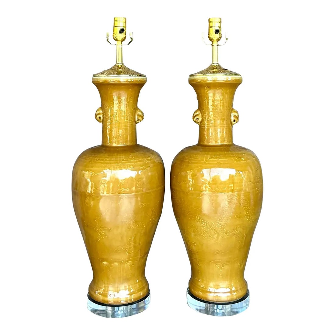 Pair of Vintage Boho Mustard Yellow Porcelain Dragon Lamps: Pair of Vintage Boho Mustard Yellow Porcelain Dragon Lamps Enhance your decor with this captivating pair of vintage porcelain lamps. Adorned with a vibrant mustard-yellow glaze, these lamps feature a