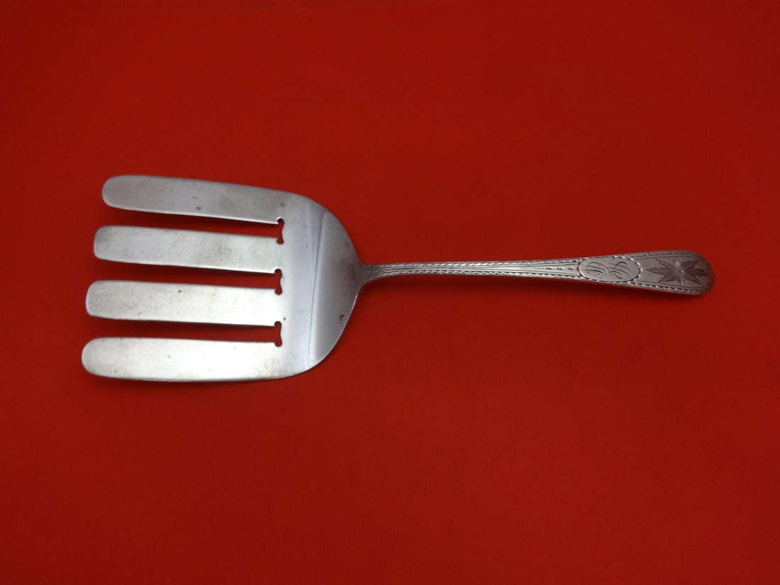 Dominick & Haff Sterling Silver Pointed Antique Engraved Asparagus Fork 9 1/4": Dominick & Haff Sterling Silver Pointed Antique Engraved Asparagus Fork 9 1/4" This exquisite serving fork from Dominick & Haff is crafted in sterling silver, showcasing the elegant Pointed Antique pa