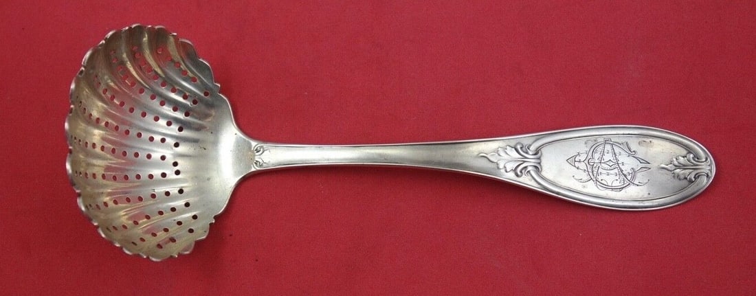 Olive Pattern Sterling Silver Sugar Sifter Ladle 7 Inch with Crest: Olive Pattern Sterling Silver Sugar Sifter Ladle 7 Inch with Crest This exquisite Olive pattern sugar sifter ladle is crafted from sterling silver and showcases the artistry of various makers. Dating