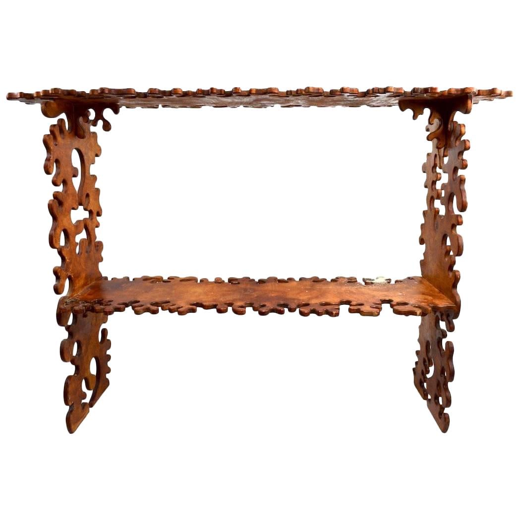 Unique Nicola L Style Groovy Cut-Out Plywood Shelf: Unique Nicola L Style Groovy Cut-Out Plywood Shelf Discover the unique charm of this two-tier shelf designed in the playful style of Nicola L. Crafted from laminate wood, this Groovy cut-out shelf fea