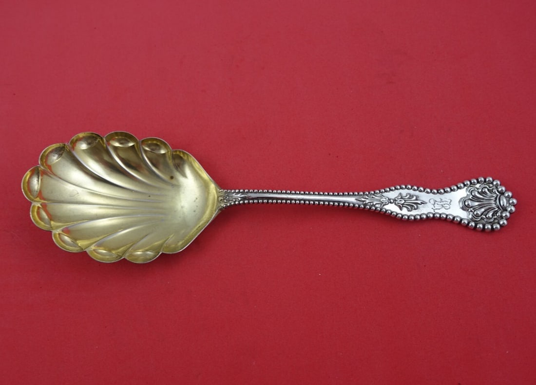 Dominick & Haff Charles II Sterling Silver Berry Spoon Gold Wash 7 3/4": Dominick & Haff Charles II Sterling Silver Berry Spoon Gold Wash 7 3/4" This exquisite serving spoon is a sterling silver berry spoon from the renowned Dominick & Haff, featuring the elegant Charles I