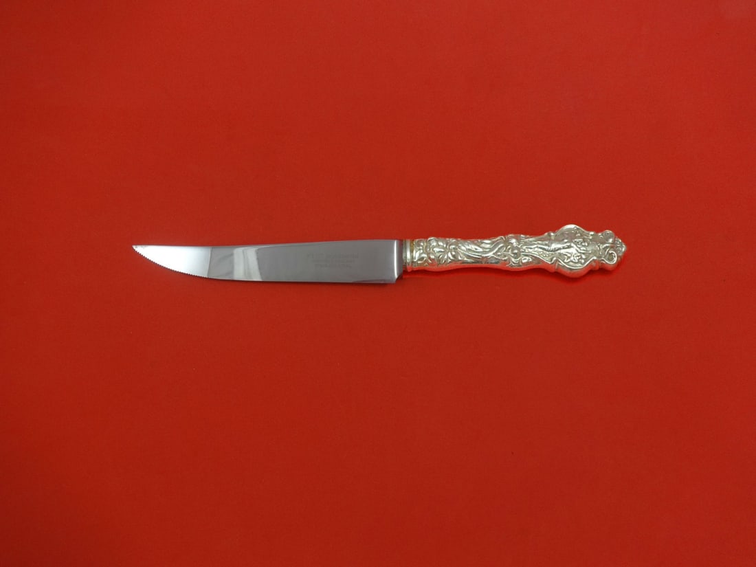 Wallace Irian Sterling Silver Steak Knife 8.5 Custom Made Serrated: Wallace Irian Sterling Silver Steak Knife 8.5 Custom Made Serrated This elegant steak knife features the Irian pattern by Wallace, crafted with a sterling silver hollow handle and a stainless steel se