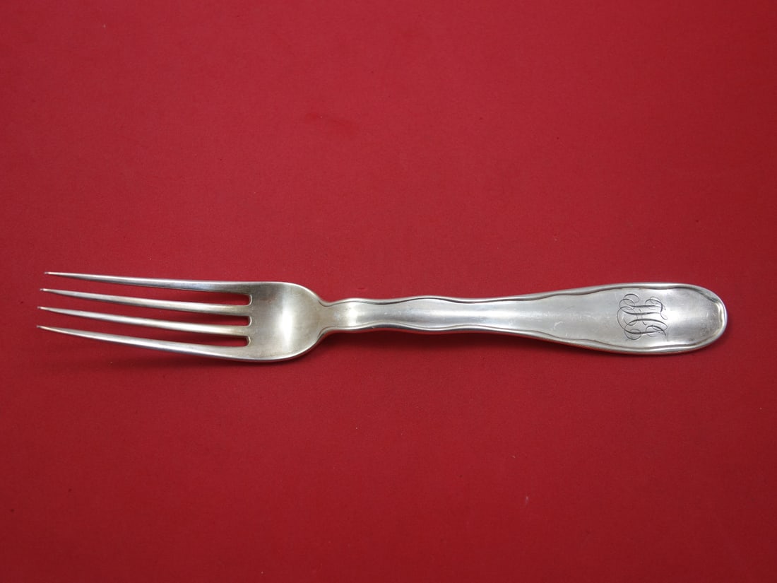 Tiffany & Co Sterling Silver Dinner Fork Lap Over Edge Plain 7 7/8": Tiffany & Co Sterling Silver Dinner Fork Lap Over Edge Plain 7 7/8" This exquisite dinner fork is crafted from sterling silver and features the elegant Lap Over Edge Plain pattern by Tiffany & Co. Mea