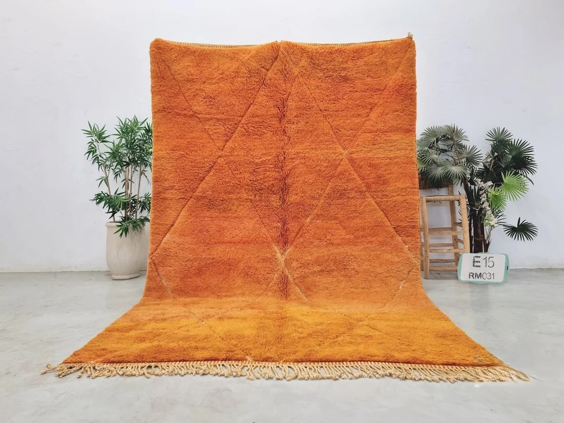 Handmade Soft Orange Wool Rug with Geometric Pattern from Morocco: Handmade Soft Orange Wool Rug with Geometric Pattern from Morocco Discover the beauty of this elegant soft orange handmade wool rug, featuring a striking geometric engraved pattern. Skillfully handwov