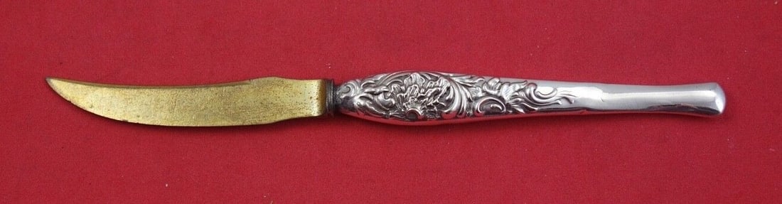 Shiebler Number 7511 Sterling Silver Fruit Knife with Gold Wash 6.75": Shiebler Number 7511 Sterling Silver Fruit Knife with Gold Wash 6.75" This exquisite fruit knife, crafted by Shiebler, features a stunning sterling silver hollow handle with a luxurious gold wash. The