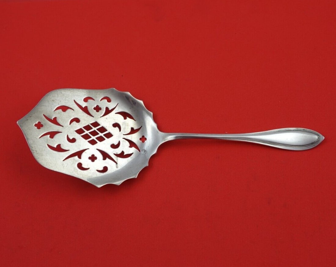 Newburyport Sterling Silver 7 1/4 Inch Pierced Tomato Server: Newburyport Sterling Silver 7 1/4 Inch Pierced Tomato Server This exquisite tomato server from Newburyport showcases a classic design, crafted from high-quality sterling silver. With a length of 7 1/4