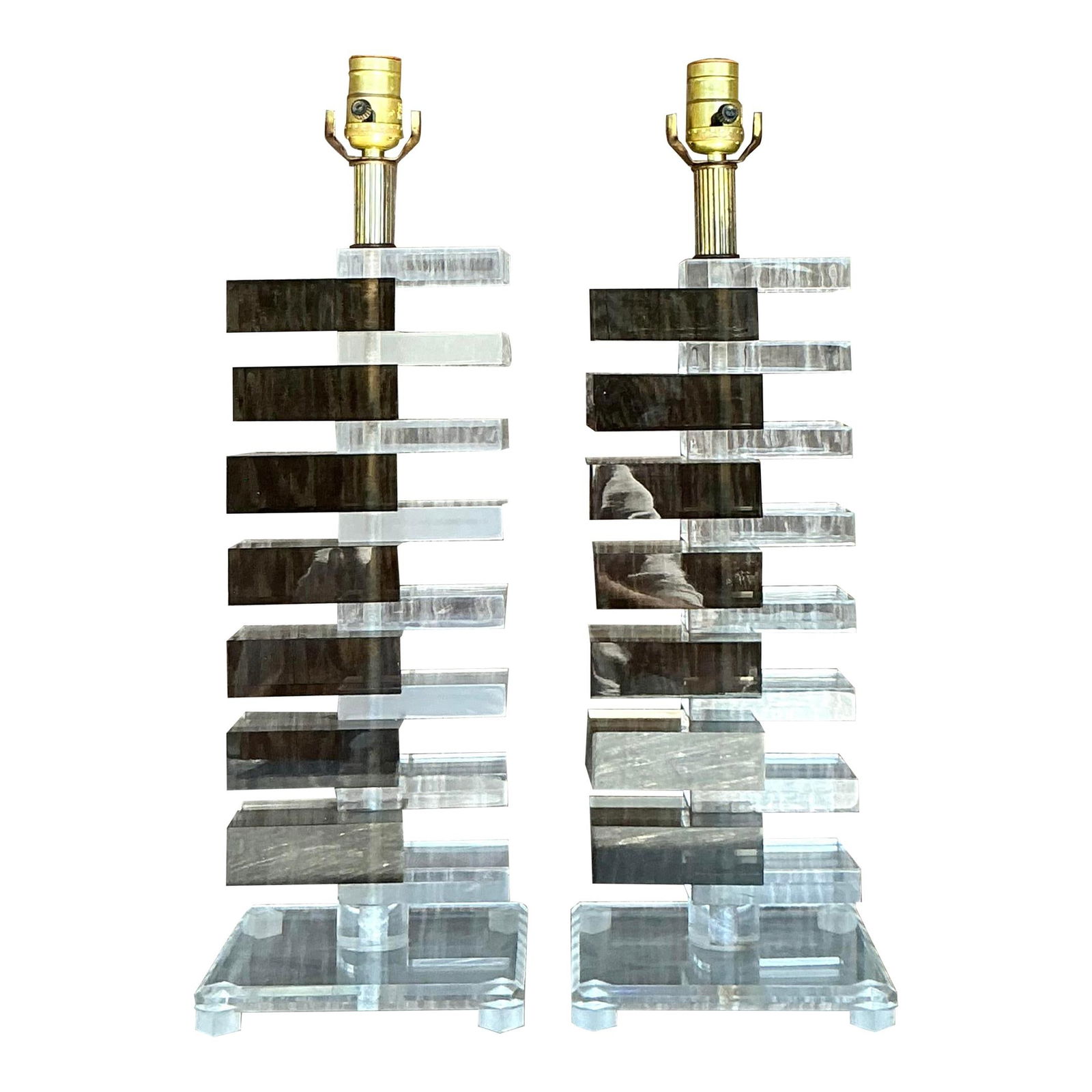 Pair of Vintage Boho Lucite Skyscraper Lamps 24.25 Tall: Pair of Vintage Boho Lucite Skyscraper Lamps 24.25 Tall Elevate your space with this stunning pair of vintage Boho stacked Lucite skyscraper lamps. Crafted with alternating layers of clear and smoky L
