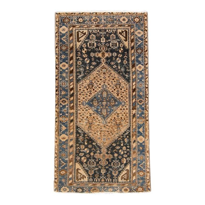 1960s Handmade Tribal Blue Wool Rug 3'5 x 6'5 Distressed Design: 1960s Handmade Tribal Blue Wool Rug 3'5 x 6'5 Distressed Design Discover the charm of this 1960s Vintage Distressed Handmade Tribal Wool Rug. Featuring a stunning blue field, the rug showcases an intr
