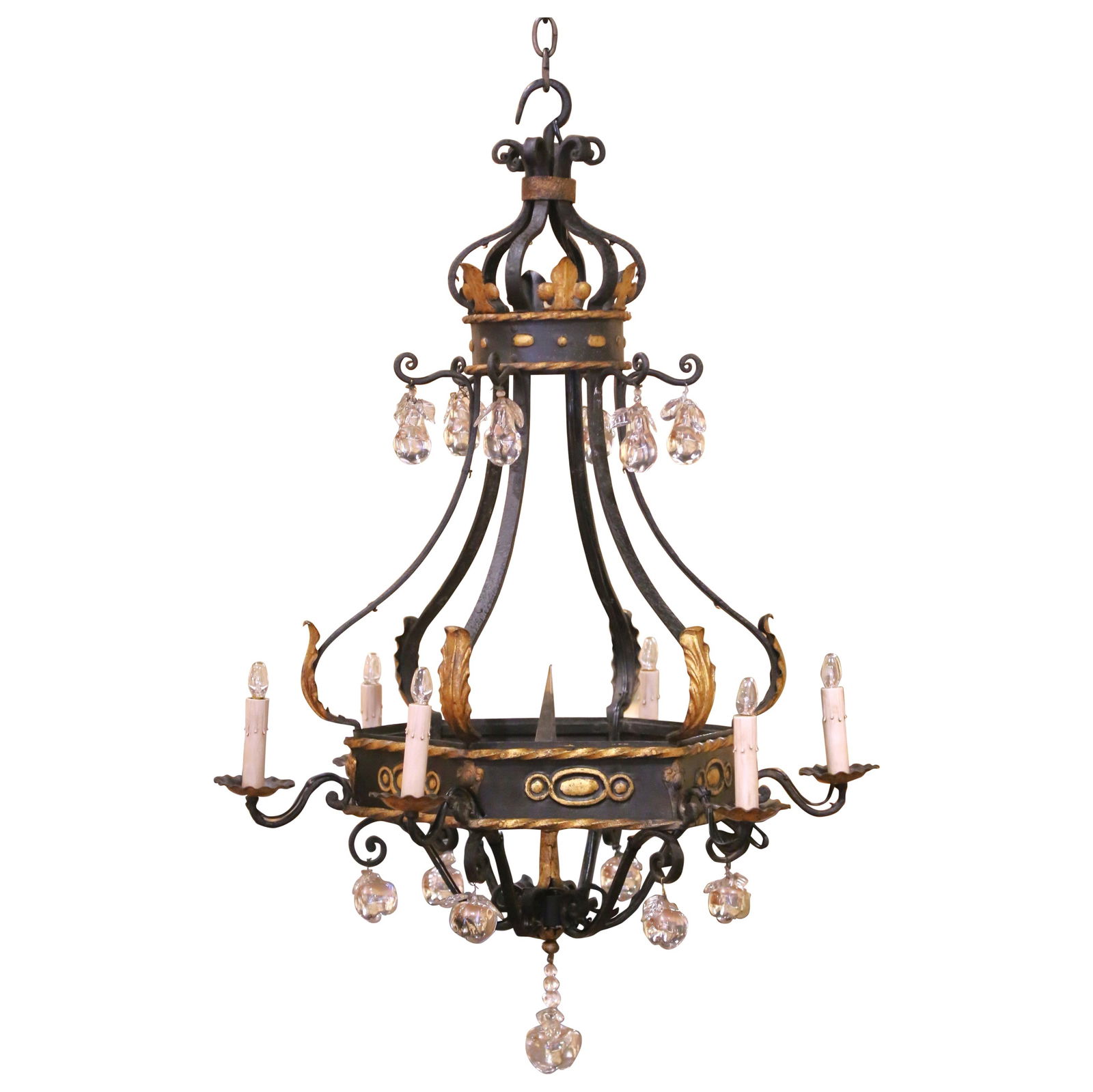 French Louis XV Style Iron and Gilt Chandelier with Crystal Drops circa 1920: French Louis XV Style Iron and Gilt Chandelier with Crystal Drops circa 1920 This early 20th-century French Louis XV chandelier features a hand-crafted iron frame with a deep black patina, accented by