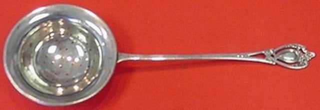 Lunt Monticello Sterling Silver Tea Strainer 7 1/8 Inch: Lunt Monticello Sterling Silver Tea Strainer 7 1/8 Inch This elegant tea strainer, crafted from high-quality sterling silver, features the classic Monticello pattern by Lunt. Measuring 7 1/8 inches, i