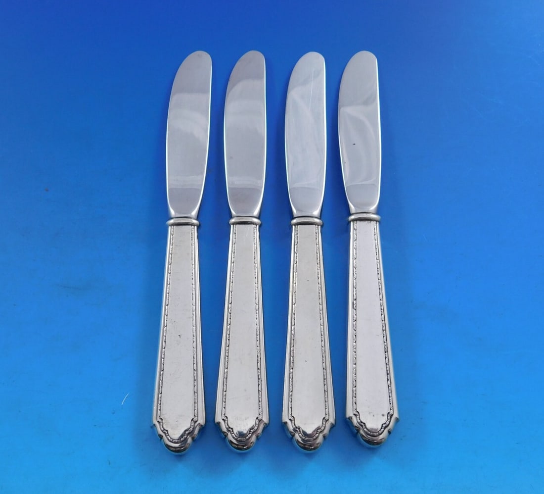 Lunt William and Mary Sterling Silver Butter Spreaders Set of 4: Lunt William and Mary Sterling Silver Butter Spreaders Set of 4 Enhance your dining experience with this elegant set of four butter spreaders, crafted in the timeless William and Mary pattern by Lunt.