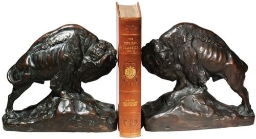 Majestic Oxblood Red Buffalo Bookends American West Style: Majestic Oxblood Red Buffalo Bookends American West Style Introducing the Majestic Red Buffalo Prairie Lodge Bookends, a stunning decorative accessory that captures the essence of the American West. T
