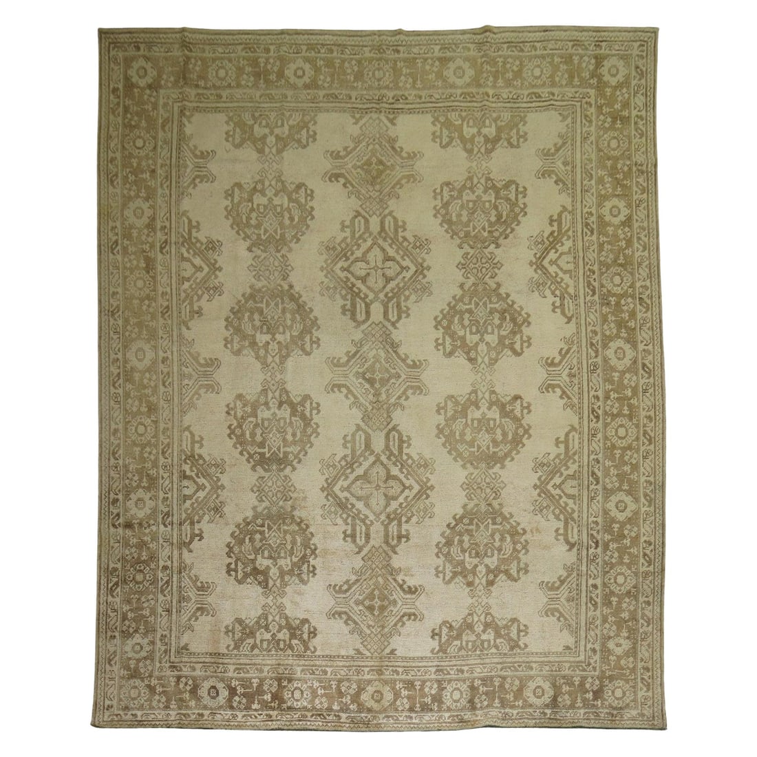Antique Turkish Oushak Room Size Hand-Knotted Wool Rug 9'9 x 12'2: Antique Turkish Oushak Room Size Hand-Knotted Wool Rug 9'9 x 12'2 This stunning antique Turkish Oushak rug, crafted in the early 20th century around 1920, showcases a beautiful beige ground with elega