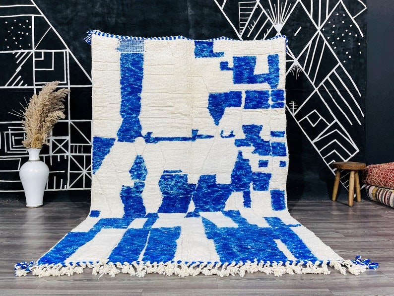 Handwoven Blue White Wool Rug 100% Sheep Wool Morocco: Handwoven Blue White Wool Rug 100% Sheep Wool Morocco Indulge in the elegance of this Luxurious Soft Blue & White Wool Rug, handwoven by local Berber women weavers in the stunning Atlas Mountains. Cra