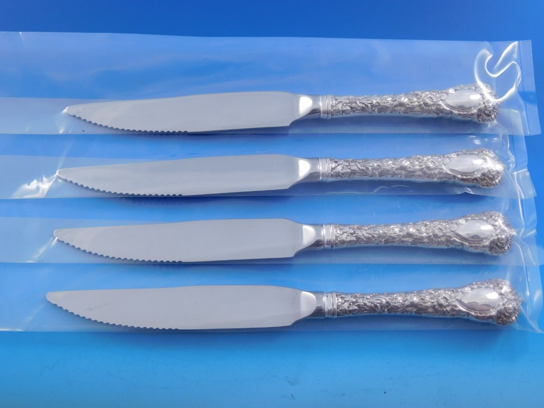 Durgin Chrysanthemum Sterling Silver 4pc Steak Knife Set 8 3/8": Durgin Chrysanthemum Sterling Silver 4pc Steak Knife Set 8 3/8" Enhance your dining experience with this exquisite set of four Durgin Sterling Silver Steak Knives, featuring the elegant Chrysanthemum