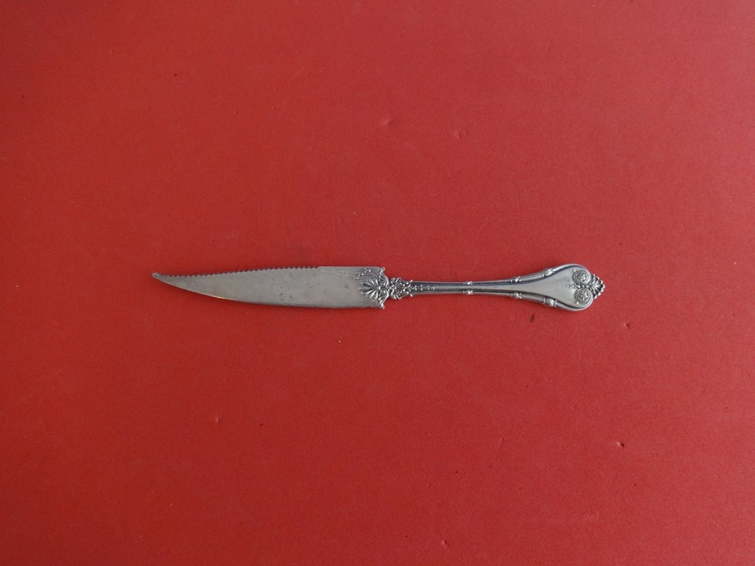 Whiting Empire Sterling Silver Citrus Knife Serrated 6 3/8": Whiting Empire Sterling Silver Citrus Knife Serrated 6 3/8" This exquisite Empire citrus knife by Whiting is crafted from high-quality sterling silver, showcasing a serrated fancy blade. Measuring 6 3